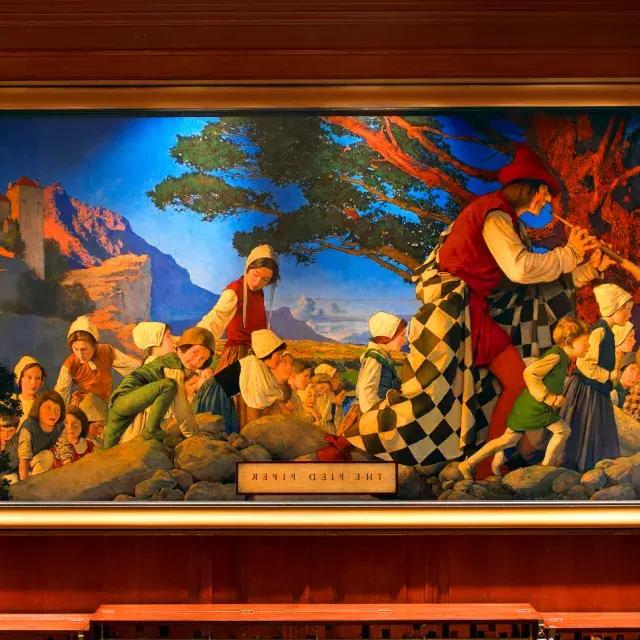 Peinture murale du joueur de flûte au Palace Hotel